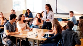 a teacher instructing her students